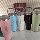 Set of colorful tumblers with handles