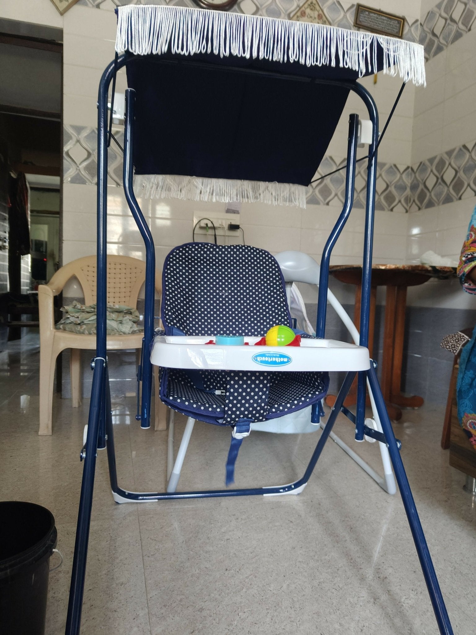MOTHERTOUCH baby swing with a comfortable cushioned seat, gentle swinging motion, secure safety harness, sturdy frame, and soothing design for newborns and infants.