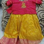 Red and yellow traditional outfit with intricate designs 