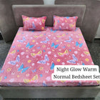 Pink butterfly-patterned bedsheet set on a bed 