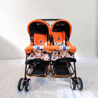MEE MEE Twin Baby Stroller/Double Pram in Orange, Some Used condition, featuring two seats, reclining design, protective canopies and a foldable frame for convenient outings with twins or two young children.