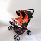 MEE MEE Twin Baby Stroller/Double Pram in Orange, Some Used condition, featuring two seats, reclining design, protective canopies and a foldable frame for convenient outings with twins or two young children.