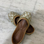 Golden Punjabi Jutti with decorative mirror work detailing for festive and traditional outfits.