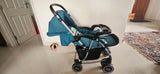 BABYHUG 2-in-1 Rock & Roll Stroller/Pram Cum Rocker with a convertible stroller and rocker design, reclining seat, reversible handle, adjustable canopy, 5-point safety harness, and foldable frame for versatile everyday use.