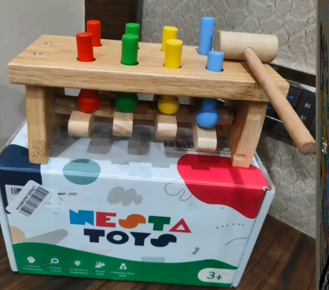NESTA TOY wooden pounding bench with hammer featuring colorful pegs, smooth child-friendly wooden construction, and an interactive design to support hand-eye coordination, fine motor skills, and early learning.