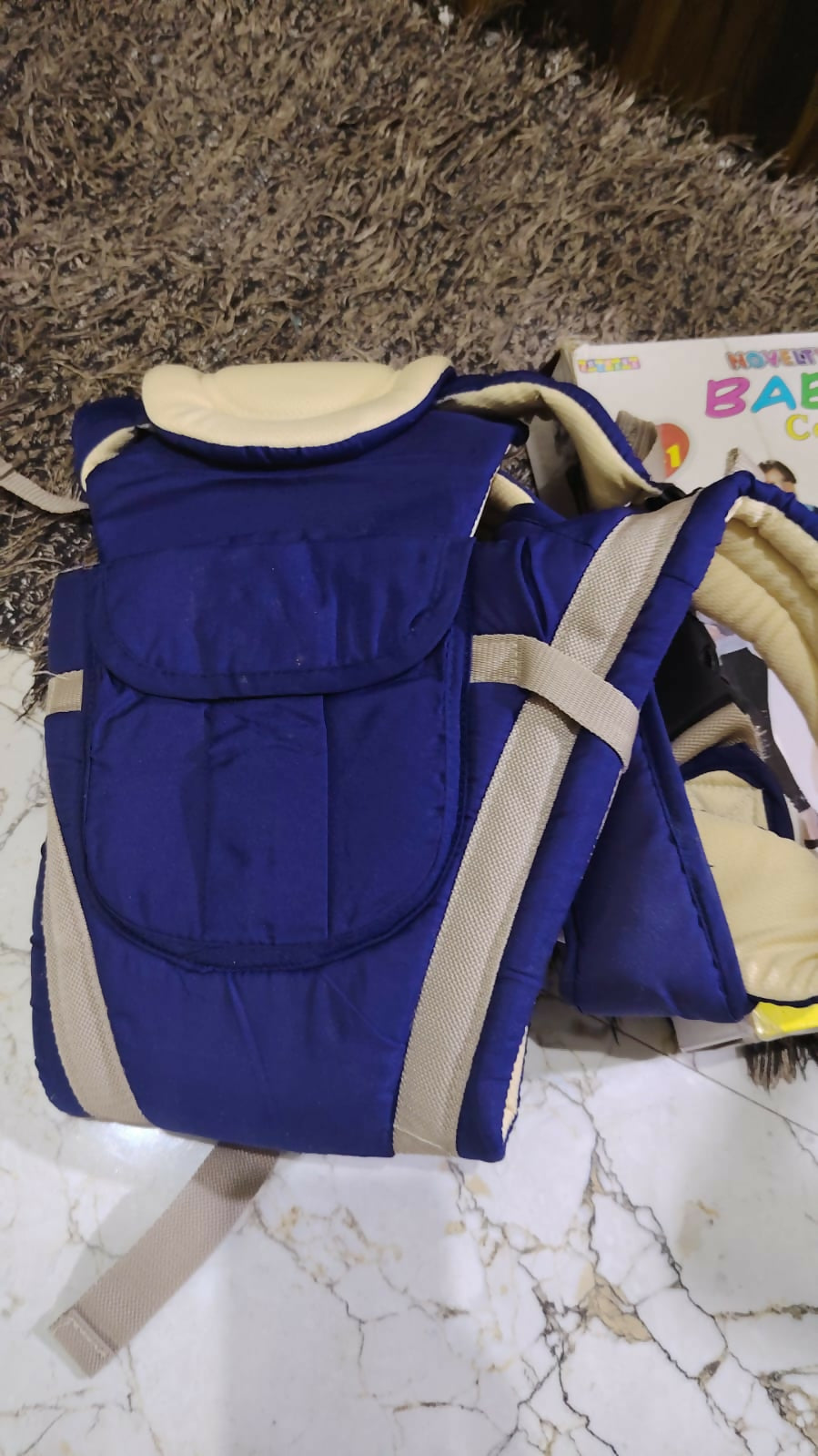 NOVELTY 4 in 1 Baby Carrier in Almost New condition featuring multiple carrying positions, adjustable straps, padded support, secure fastening, and a practical hands-free design for comfortable everyday baby carrying.