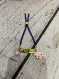 Personalized Bond Band Rakhi with charm featuring custom name personalization, decorative charm detail, comfortable band design, and a thoughtful keepsake for Raksha Bandhan celebrations.