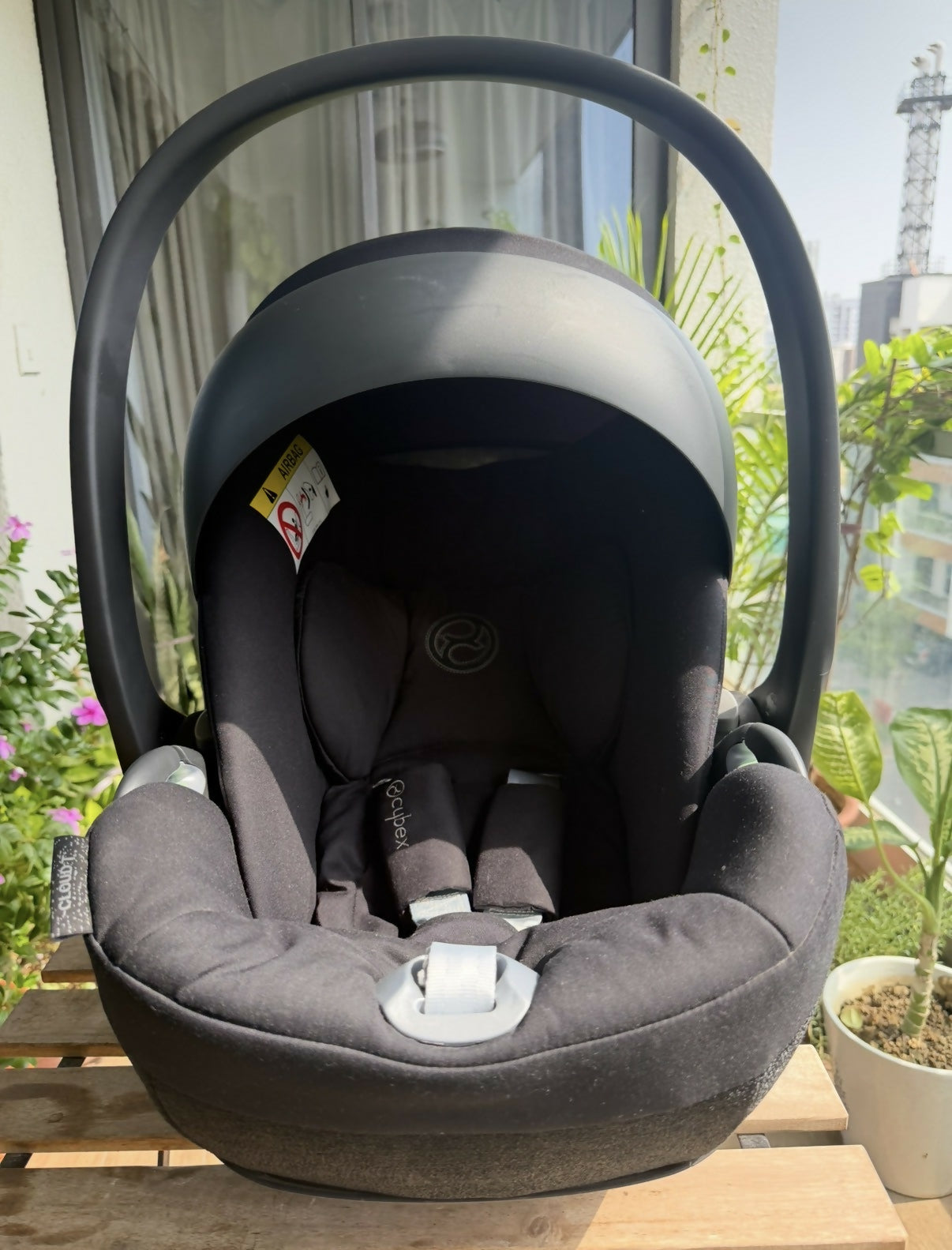 Cybex Cloud T Infant Car Seat with ergonomic reclining design, padded infant support, adjustable headrest, safety harness, side-impact protection, and comfortable seating for secure newborn and infant travel.
