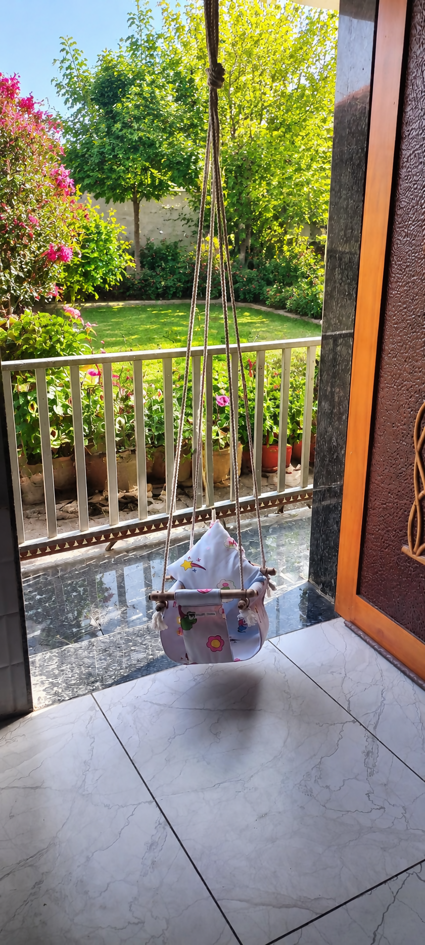Baby Swing with gentle rocking motion, comfortable padded seat, safety harness, sturdy frame, and soothing design to help keep babies relaxed, entertained, and comfortable during supervised rest.