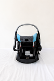 Evenflo Embrace infant car seat with base, rear-facing design, cushioned newborn support, secure safety harness, and portable baby carrier functionality for safe travel.