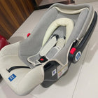 MEE MEE 4-in-1 Multi-Purpose Baby Carry Cot/Car Seat with Rocking Chair featuring padded seating, safety harness, ergonomic carry handle, protective canopy, and versatile design for travel, carrying, rocking, and seating.