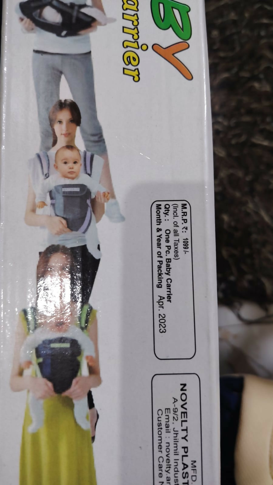 NOVELTY 4 in 1 Baby Carrier in Almost New condition featuring multiple carrying positions, adjustable straps, padded support, secure fastening, and a practical hands-free design for comfortable everyday baby carrying.