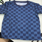 Blue checkered shirt on a white surface