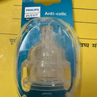 Philips Avent anti-colic baby bottle nipple on a yellow background