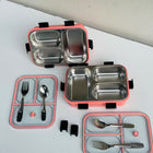 Stainless steel bento box with pink exterior and compartments, including utensils 