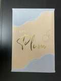 Packaging with 'Little Plum' branding on a dark background