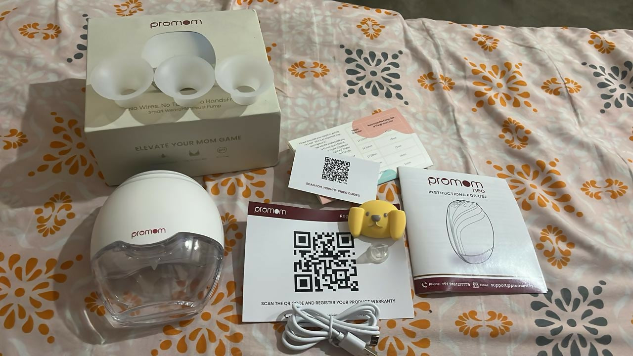 PROMOM wearable hands-free electric breast pump with compact design for comfortable milk expression, portable and convenient for breastfeeding moms.