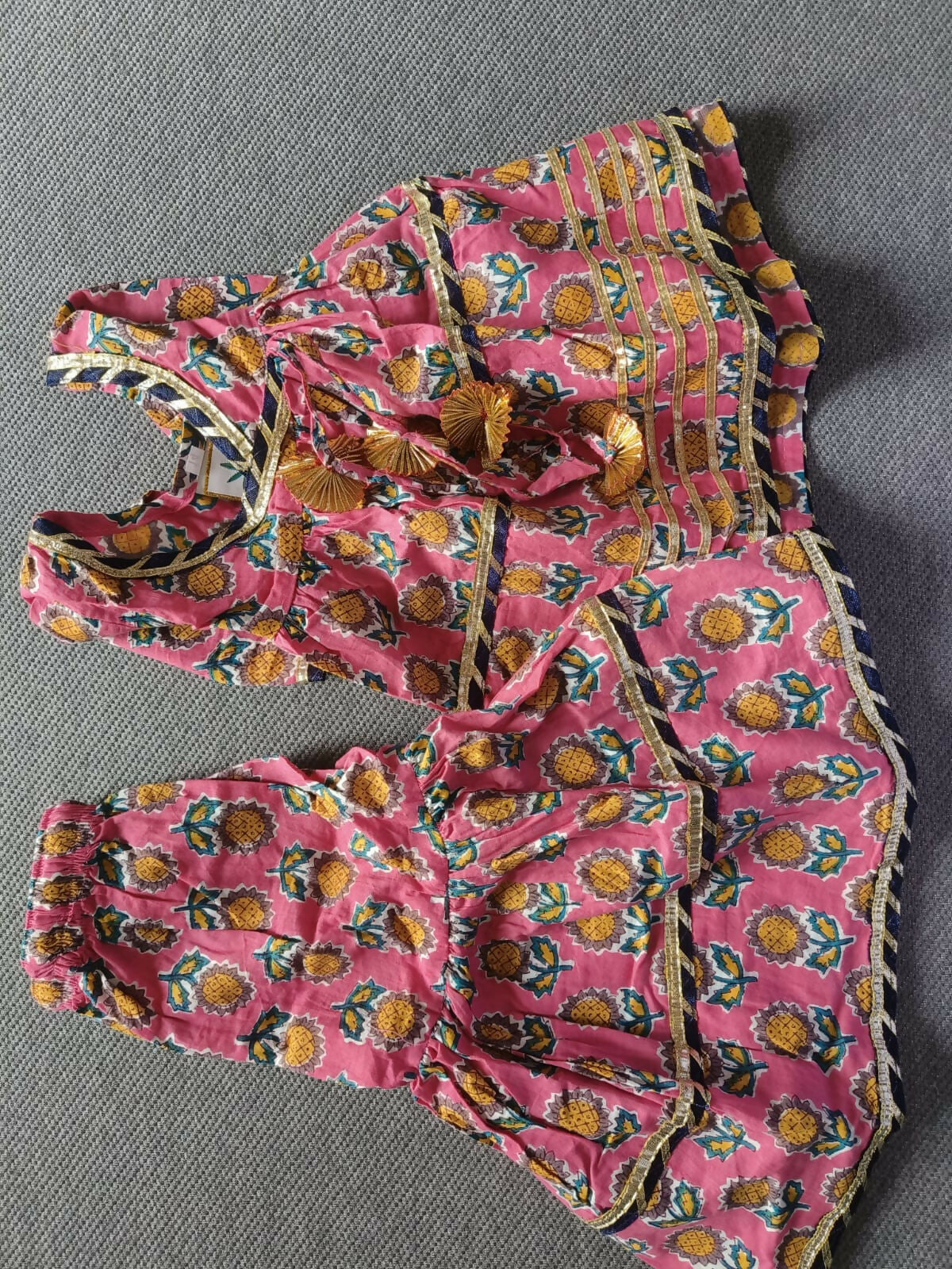 Enhance your baby girl's festive wardrobe with the TEENTARE Kurta and Sharara Set – a charming and comfortable outfit perfect for special occasions, featuring vibrant colors and intricate designs.