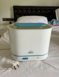 Philips Avent 3-in-1 Electric Steam Sterilizer with adjustable size configuration, natural steam sterilization, and spacious capacity for baby bottles, breast pump parts, pacifiers, and feeding accessories.