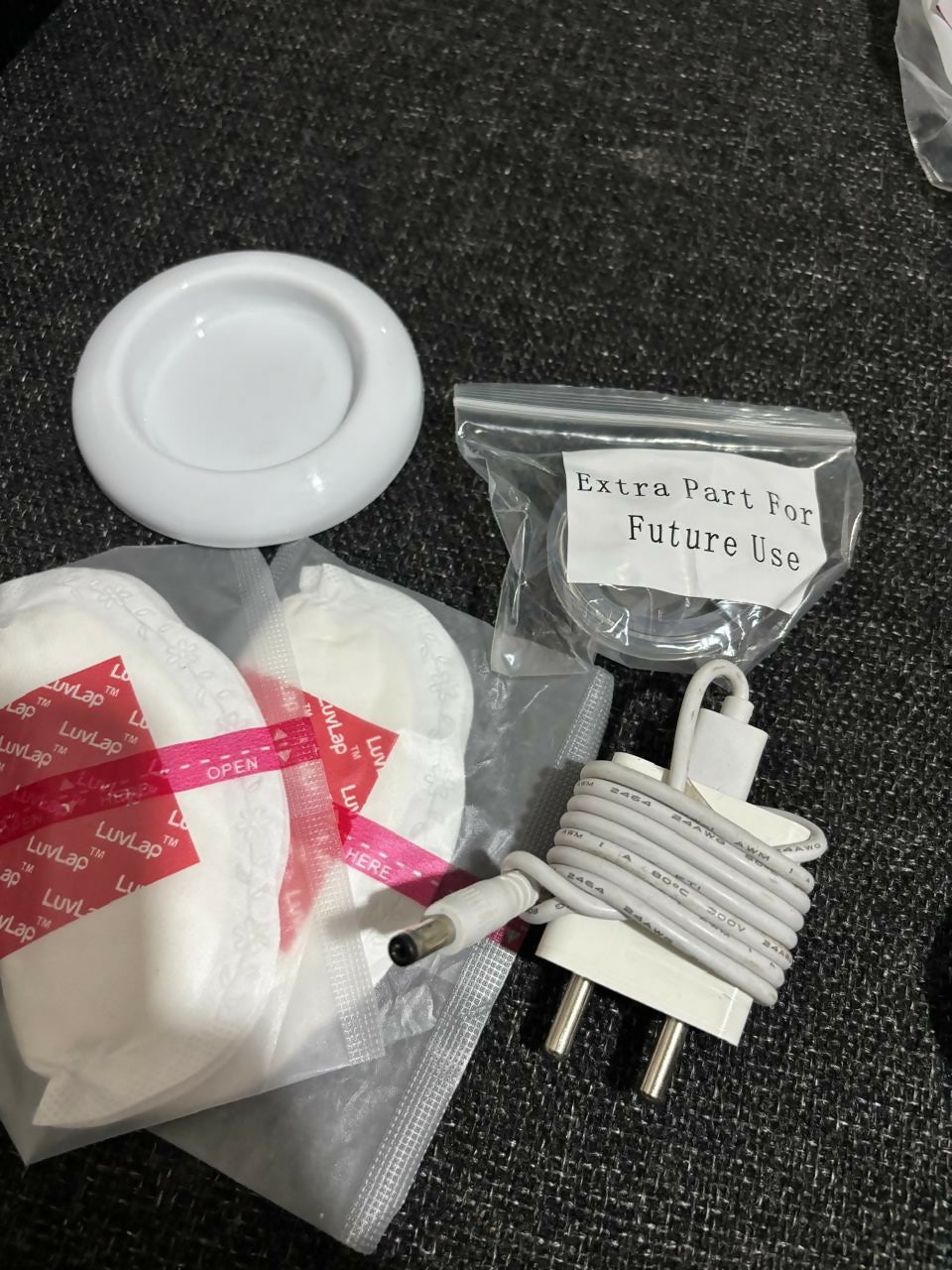 LUVLAP Adore Rechargeable Electric Breast Pump with 2 Phase Pumping in Almost New condition, featuring adjustable pumping settings, comfortable breast cushion, rechargeable operation, and a convenient design for everyday breast milk expression.