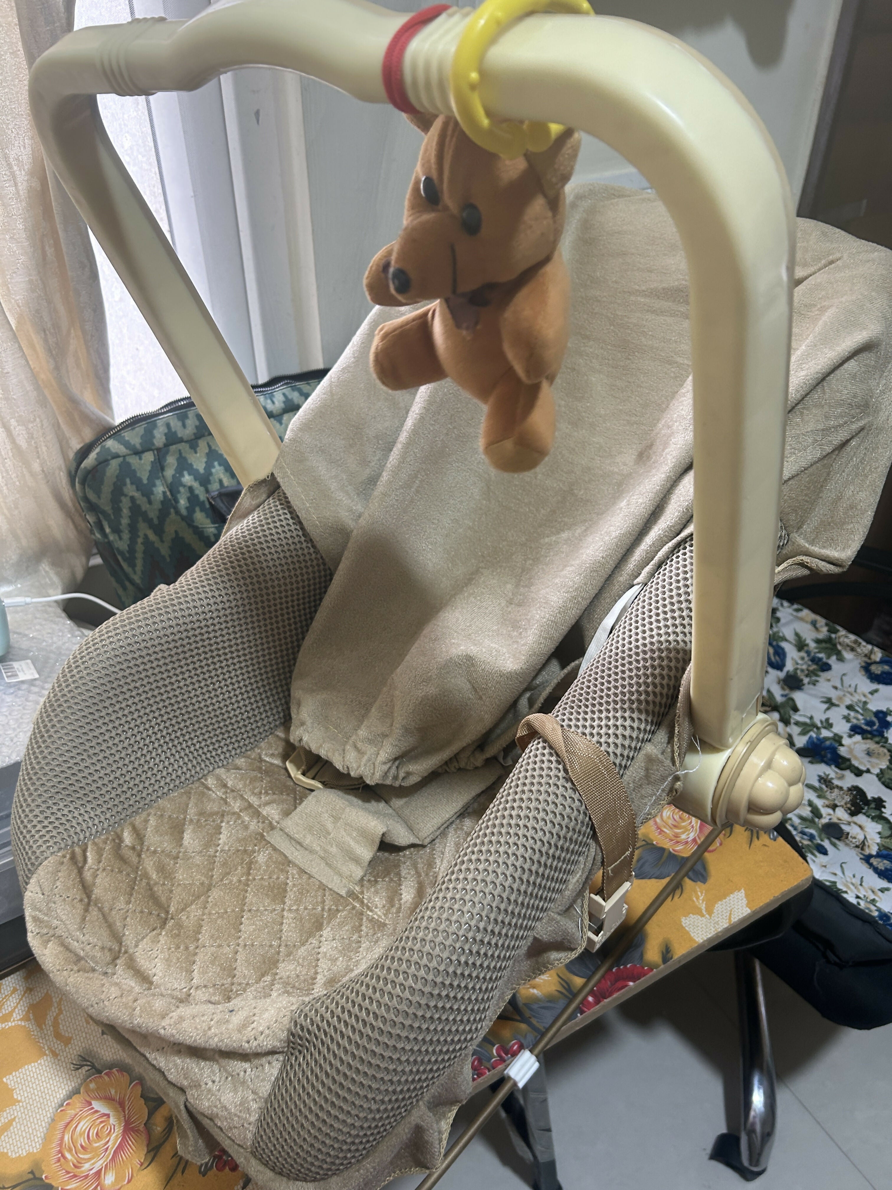 Premium 12 in 1 musical carry cot and bouncer with mosquito net, storage box, cushioned seating, soothing music features, and multi-functional design for baby comfort, play, and rest.