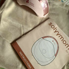 SOLYYMOMS Smart Wearable Breast Pump in Preloved New condition featuring a compact hands-free design, adjustable pumping settings and comfortable fit for convenient breast milk expression at home, work or while travelling.