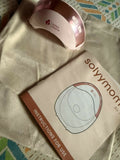 SOLYYMOMS Smart Wearable Breast Pump in Preloved New condition featuring a compact hands-free design, adjustable pumping settings and comfortable fit for convenient breast milk expression at home, work or while travelling.