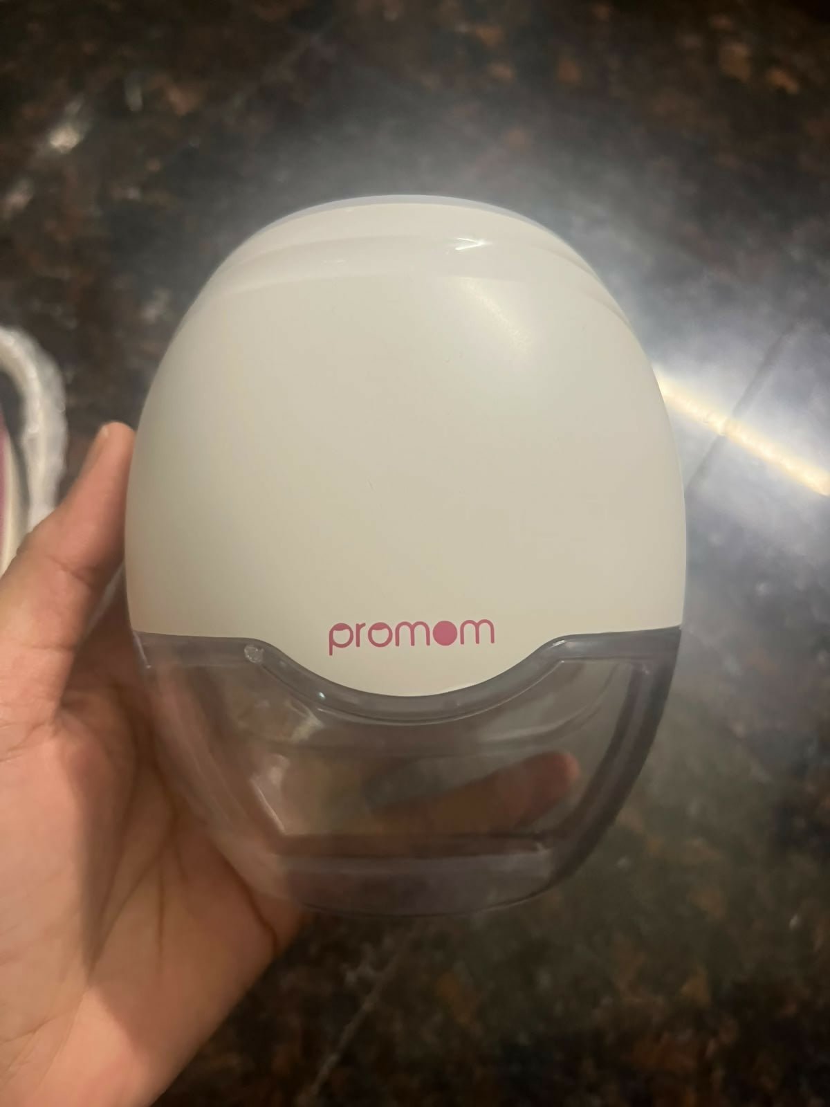 Pro Mom Wearable Breast Pump with a hands-free, compact design, adjustable suction settings, discreet in-bra fit, rechargeable operation, and milk collection cup for convenient pumping at home or on the go.