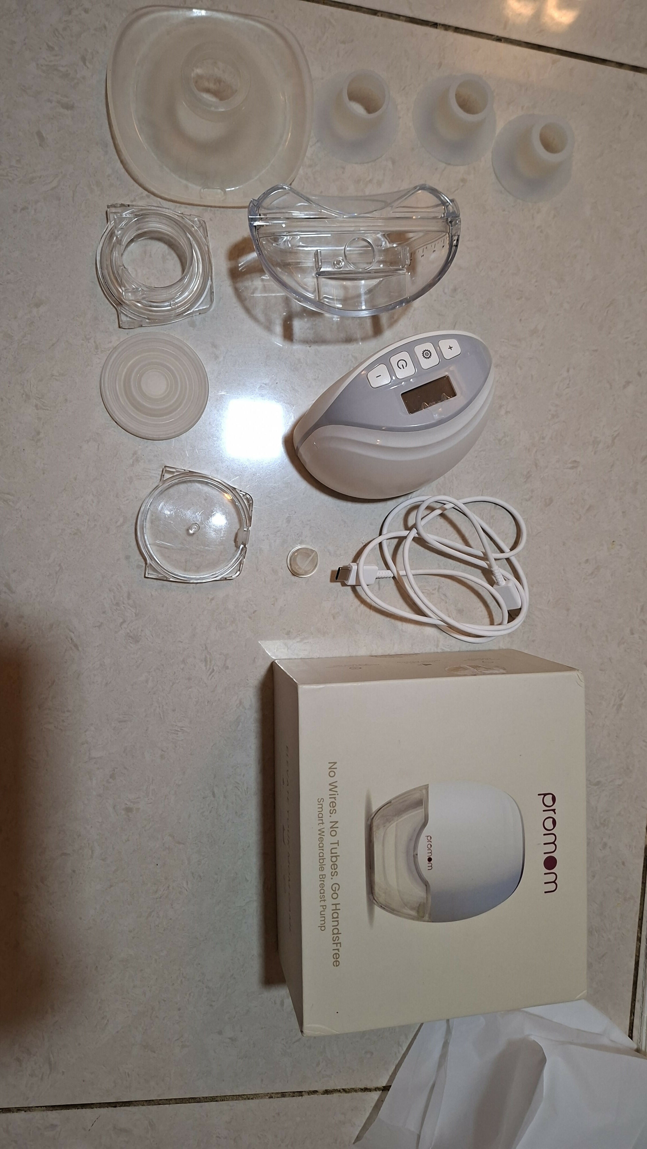 PROMOM NEO Hands-Free Breast Pump featuring a compact wearable design and adjustable pumping settings for convenient breast milk expression while at home, work or travelling.