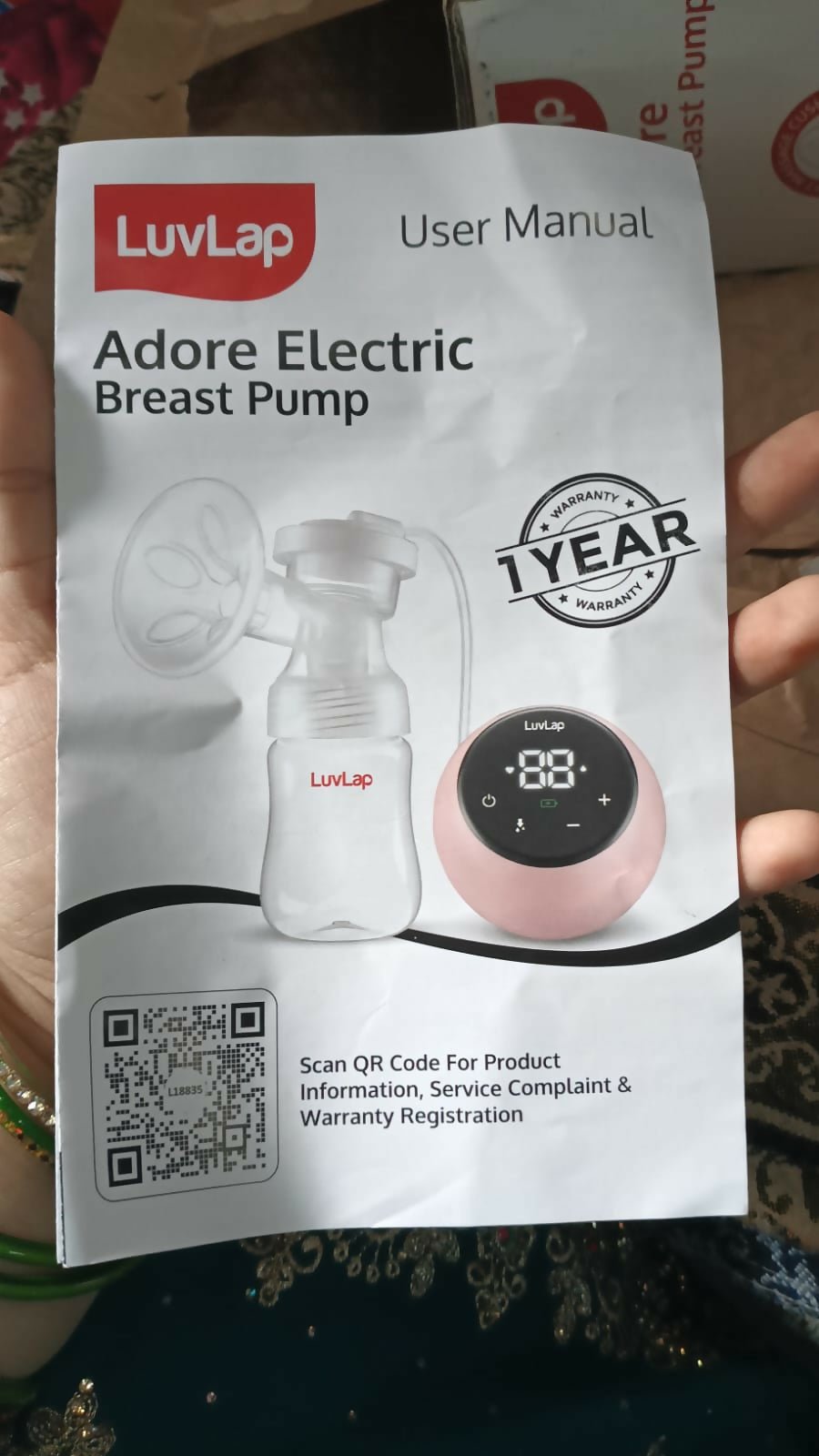 LUVLAP Single Electric Breast Pump with adjustable suction levels, soft silicone massage cushion, quiet operation, rechargeable design, BPA-free components, and ergonomic controls for comfortable and efficient milk expression.