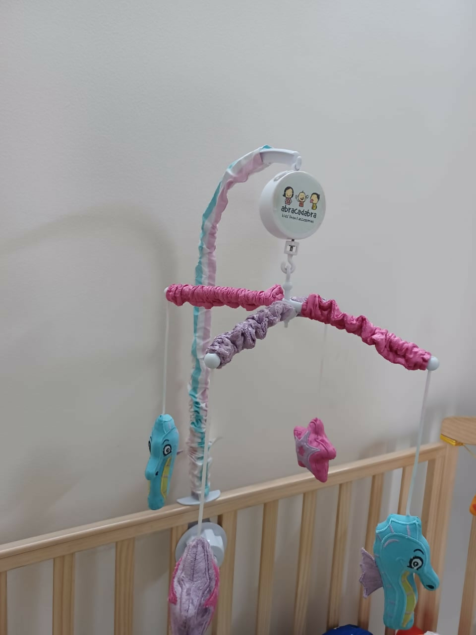 Soothe your baby to sleep with the enchanting Abracadabra Musical Cot Mobile—featuring adorable mermaids, soft melodies, and calming motion!