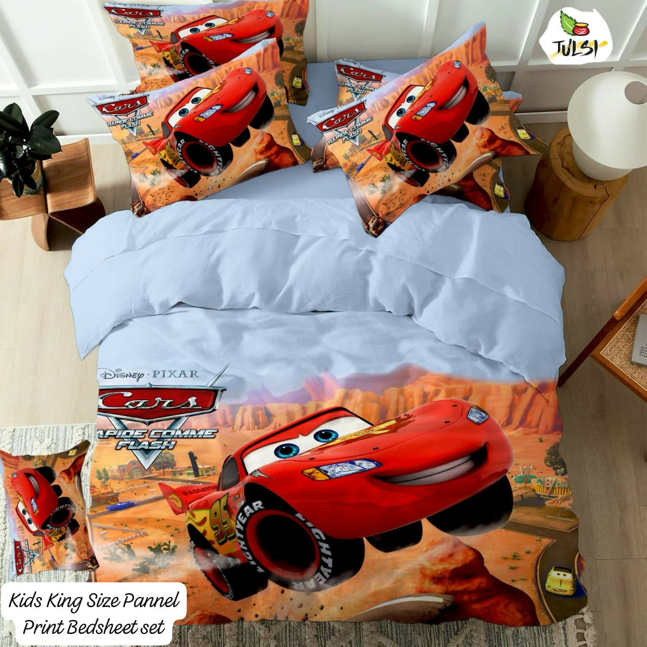 Bedding set with Disney Pixar Cars design on a bed 