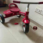 RADIO FLYER tricycle with sturdy construction, comfortable seat, easy-grip handlebars, smooth wheels, and child-friendly design for outdoor play and riding adventures.