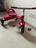 RADIO FLYER tricycle with sturdy construction, comfortable seat, easy-grip handlebars, smooth wheels, and child-friendly design for outdoor play and riding adventures.