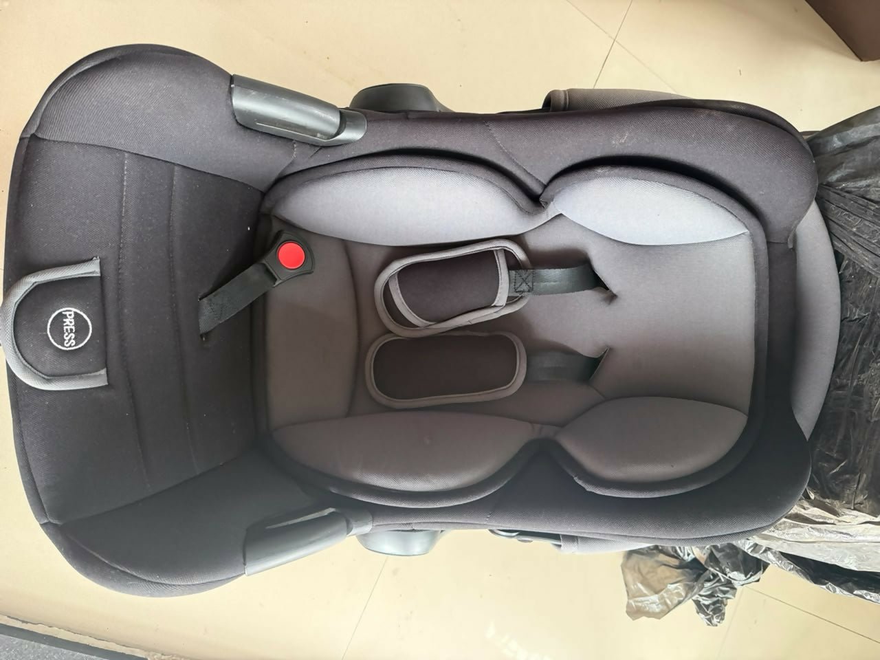 R FOR RABBIT Baby Carry Cot/Car Seat with an ergonomic carry handle, 5-point safety harness, side-impact protection, soft padded seating, and lightweight design for safe and comfortable travel with newborns and infants.