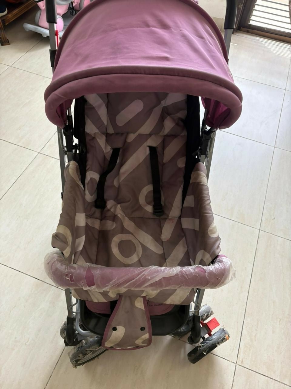 R for Rabbit Lollypop Lite baby stroller/pram with lightweight foldable design, reclining seat, adjustable canopy, 5-point safety harness, smooth wheels, and storage basket for comfortable everyday travel.