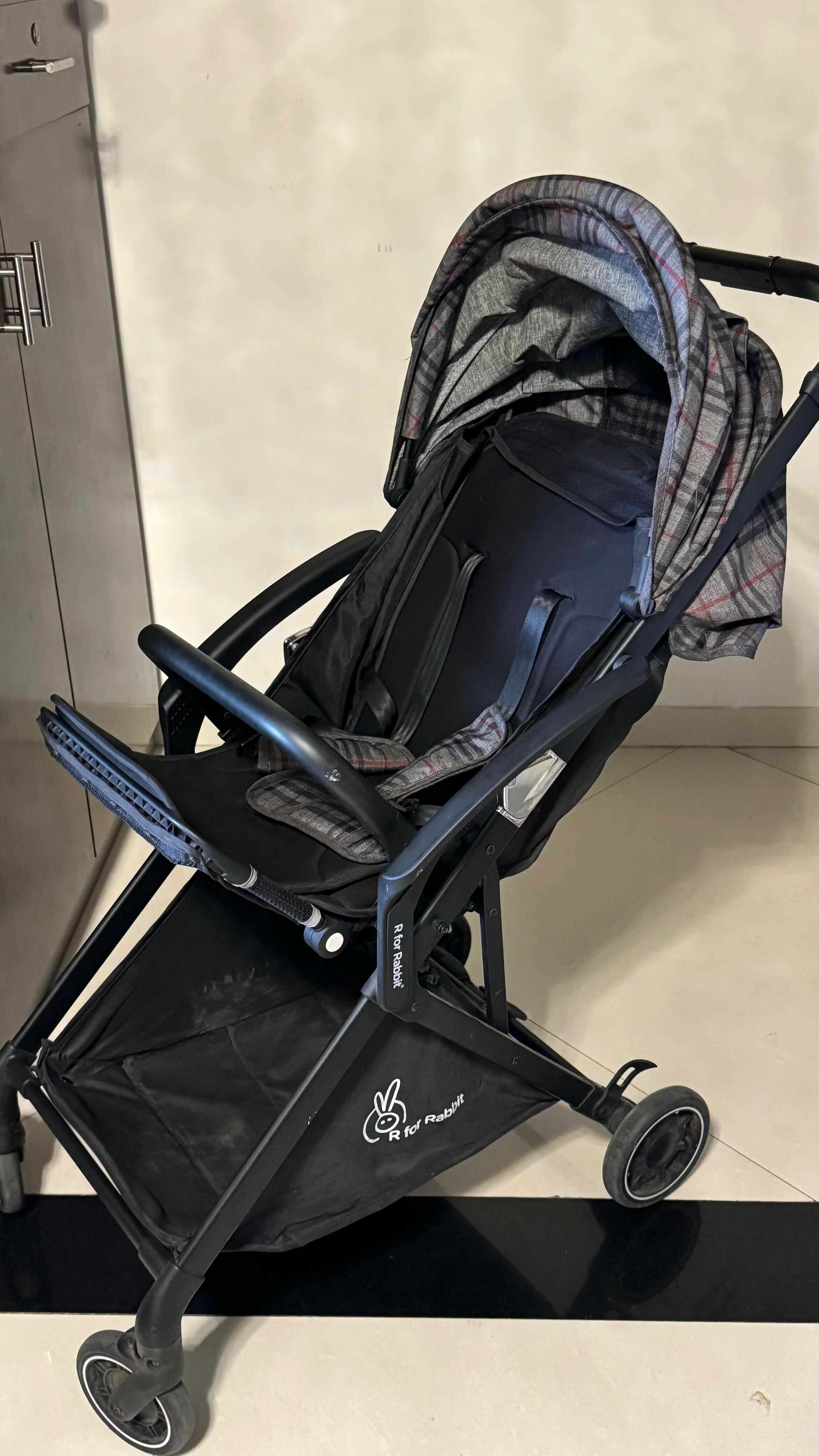 R FOR RABBIT Street Smart Nova Kids Stroller in Blue Black, Almost New condition, featuring comfortable seating, a travel-friendly design, protective canopy, safety harness, and smooth wheels for convenient everyday outings.