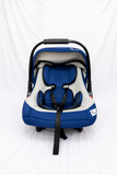 R for Rabbit infant car seat carrier with canopy, cushioned newborn support, secure safety harness, carry handle, and travel cot functionality for safe and comfortable journeys.