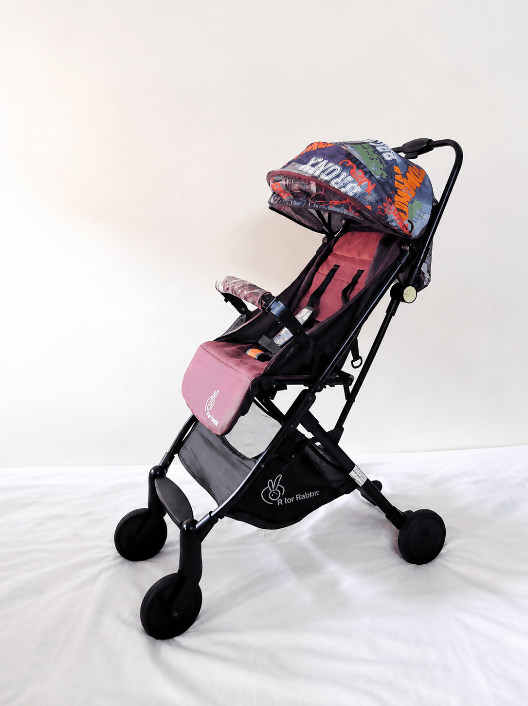 R for Rabbit Pocket Lite baby stroller with lightweight foldable design, reclining seat, adjustable canopy, 5-point safety harness, smooth wheels, and compact travel-friendly frame for babies and toddlers up to 15 kg.