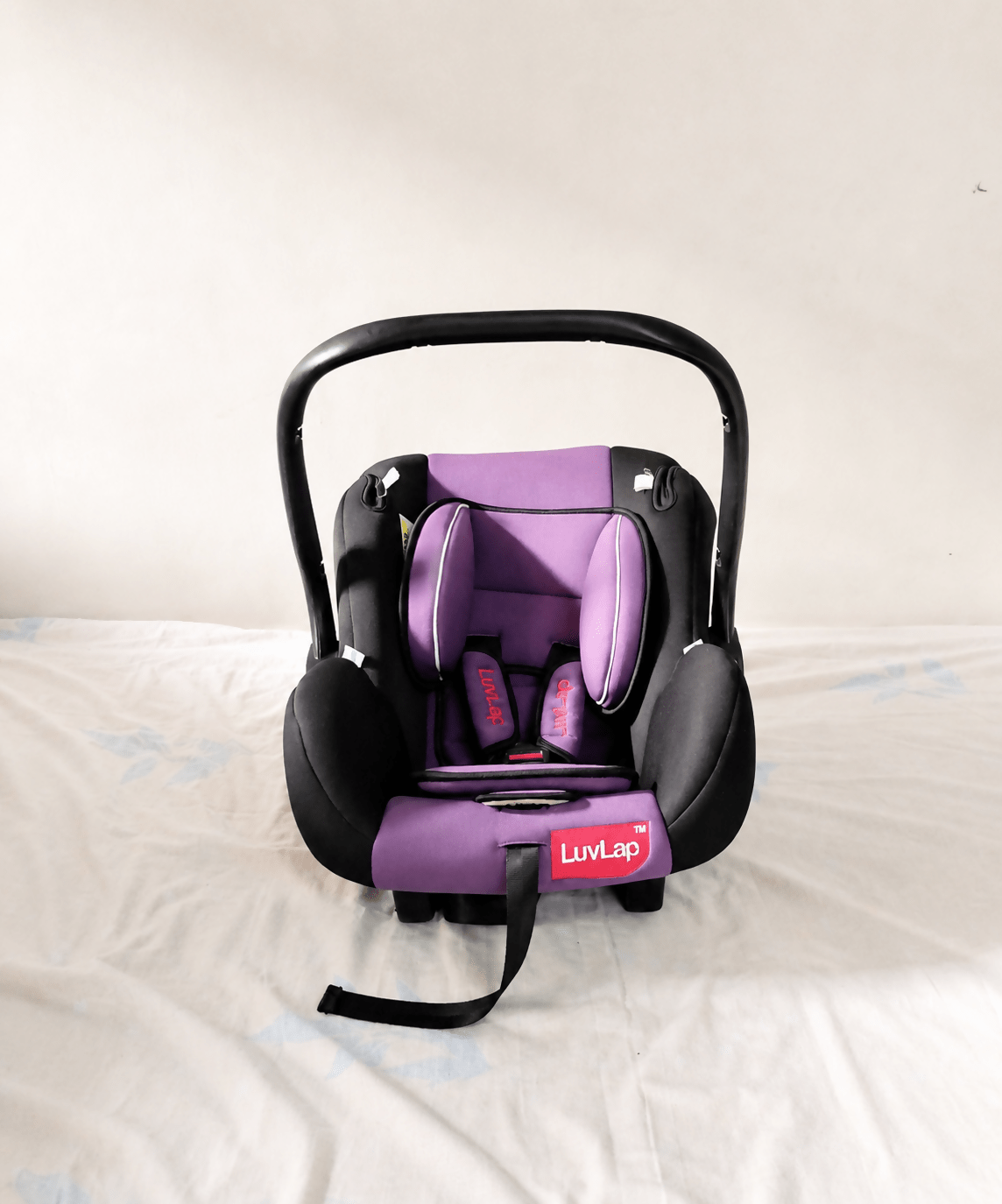 LuvLap infant car seat baby carrier with rear-facing design, carry cot function, 5-point safety harness, ergonomic carry handle, cushioned seating, and side-impact protection for newborns and infants up to 13 kg.