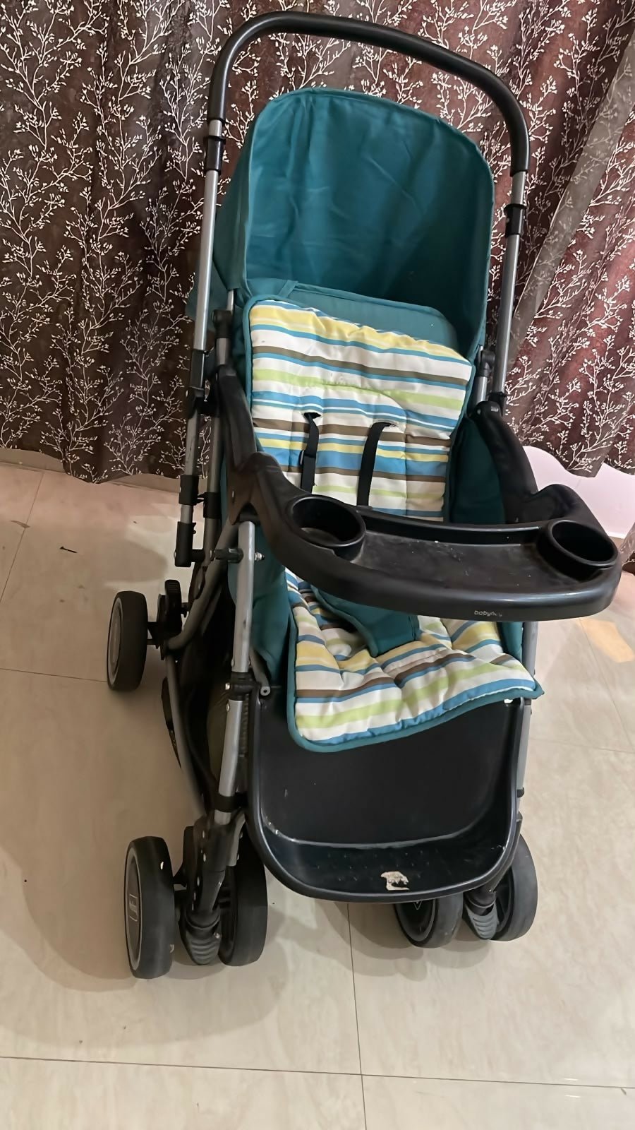 BABYHUG Stroller/Pram with a comfortable reclining seat, foldable frame, adjustable canopy, safety harness, smooth wheels, and storage basket for convenient everyday outings with babies and toddlers.