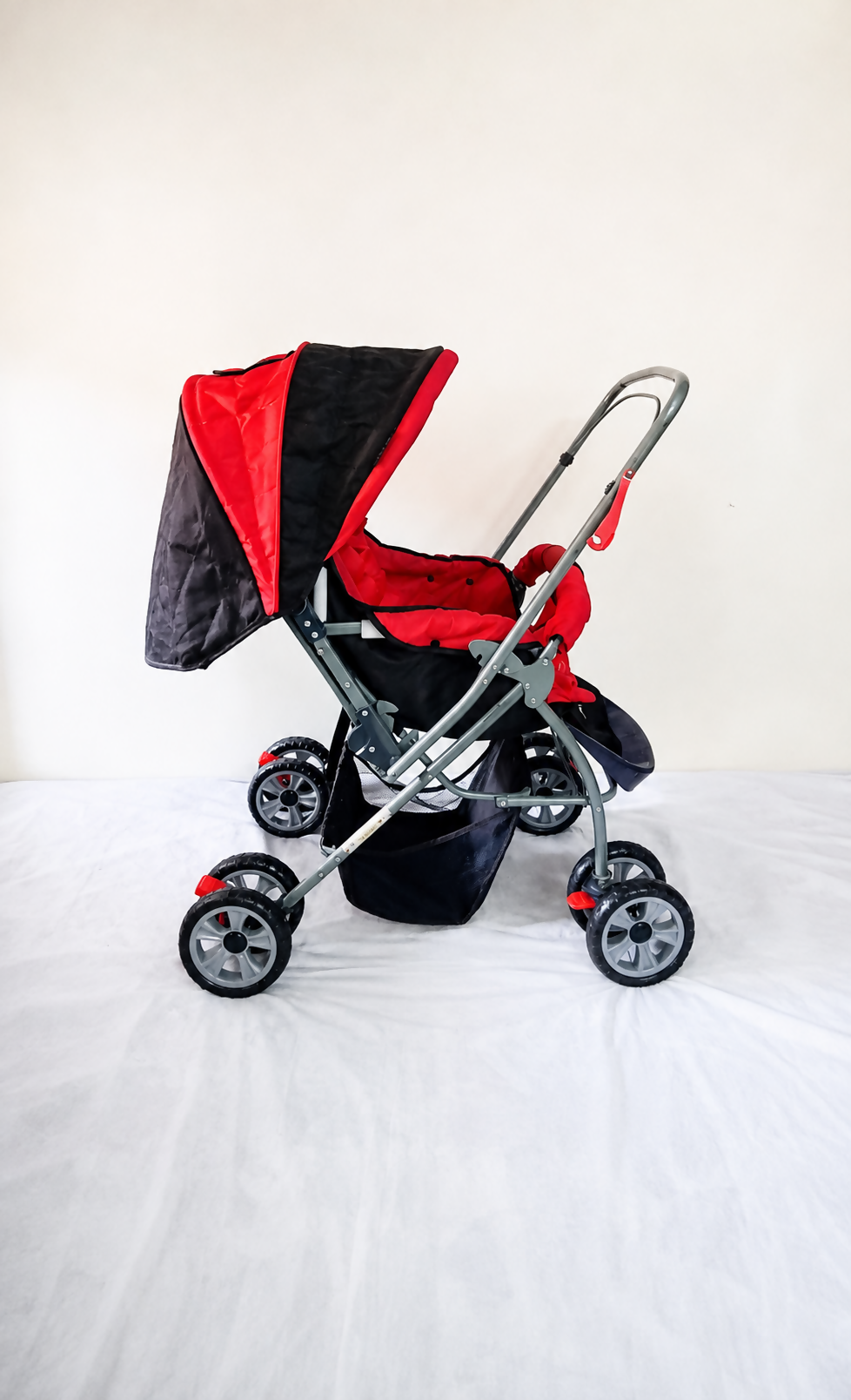 LuvLap Galaxy Baby Stroller Pram in Red & Black with reversible handle, reclining seat, adjustable canopy, safety harness, smooth wheels, foldable frame, and storage basket for comfortable baby travel.