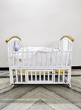HunyHuny Wooden Baby Cot Crib B102 with rocking function, lockable wheels, included mattress, spacious sleeping area, and a sturdy wooden frame for safe and comfortable sleep.