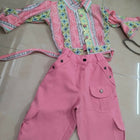 Pink outfit with patterned top and pants 
