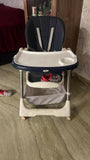 STAR AND DAISY Galaxy Star High Chair with comfortable padded seat, adjustable feeding tray, safety harness, sturdy frame, footrest, and easy-clean design for convenient baby and toddler mealtimes.