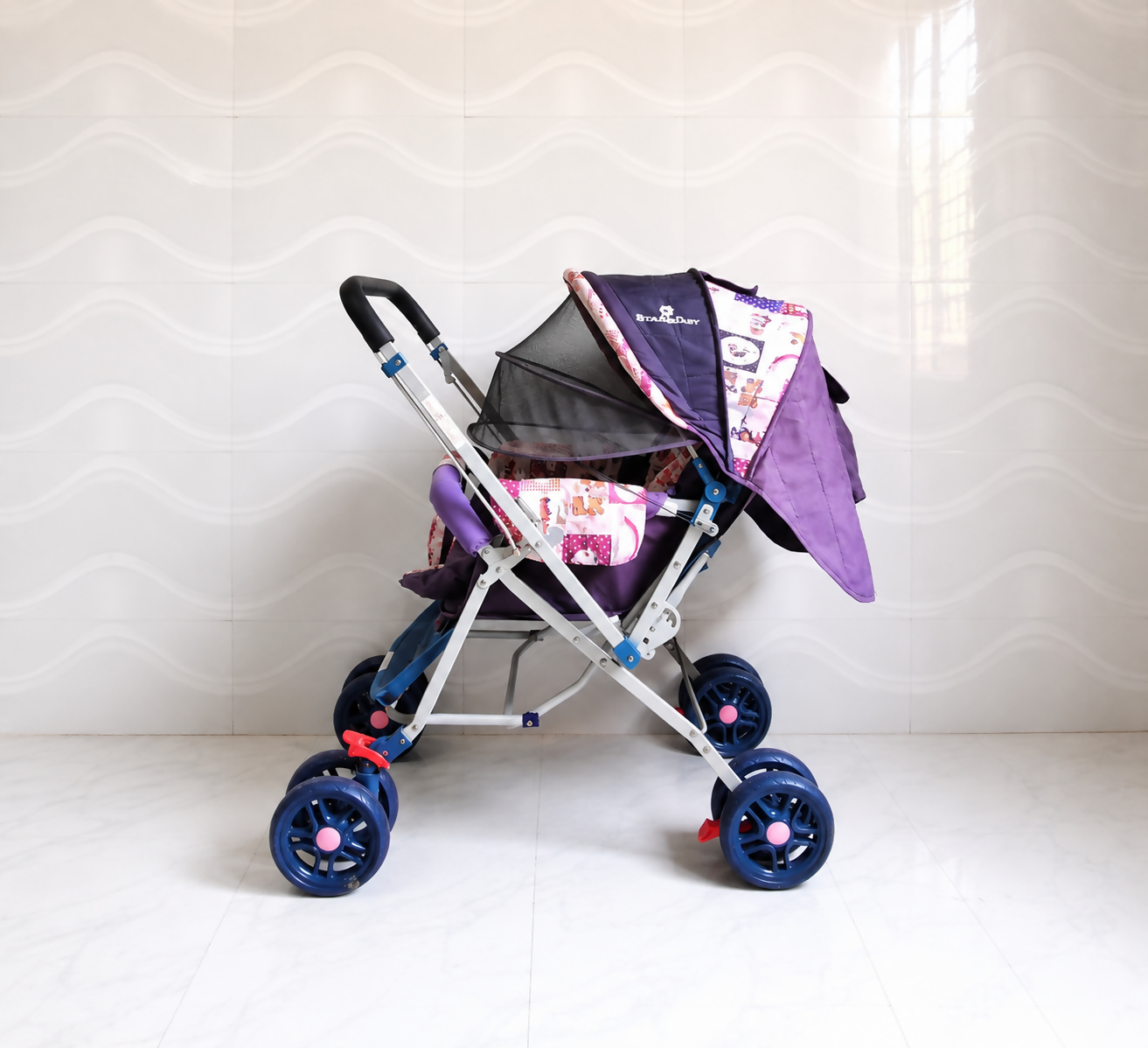 STAR & DAISY reversible baby stroller pram with mosquito net, reclining seat, reversible handle, safety harness, adjustable canopy, and comfortable travel support for babies.