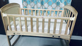 BABYHUG 4 in 1 convertible baby cot with rocking function, cozy sleeping space, sturdy frame, adjustable design, and rocking feature for baby comfort and safe sleep.
