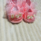 Handcrafted baby booties made from soft, baby-friendly fabric or yarn with a cozy, lightweight design to keep little feet warm, comfortable, and stylish.