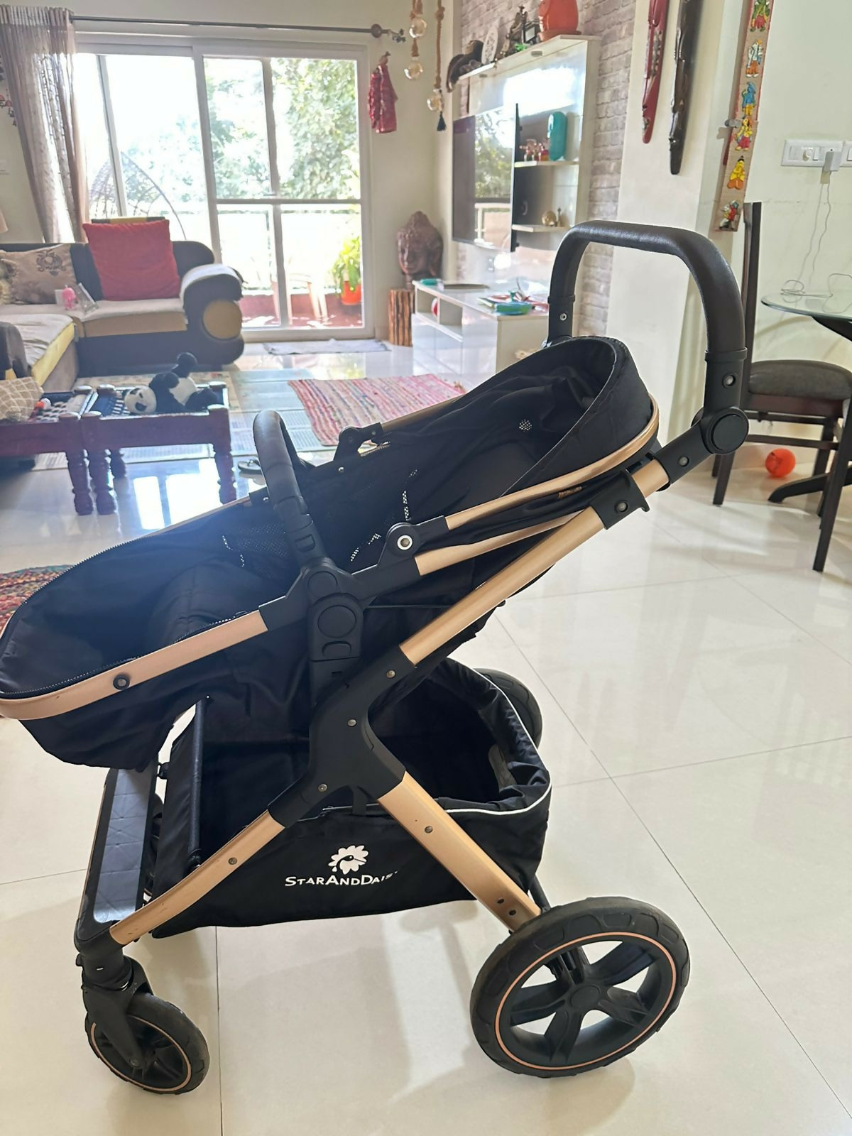 StarAndDaisy EasyGo travel-friendly luxury baby stroller pram buggy with reclining seat, smooth wheels, safety harness, adjustable canopy, and compact design for comfortable baby travel.
