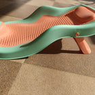 Star and Daisy Baby Bath Seat in Orange-Green, designed for babies 0–1 year with an upgraded supportive design and anti-slip base for comfortable, convenient supervised bathing.